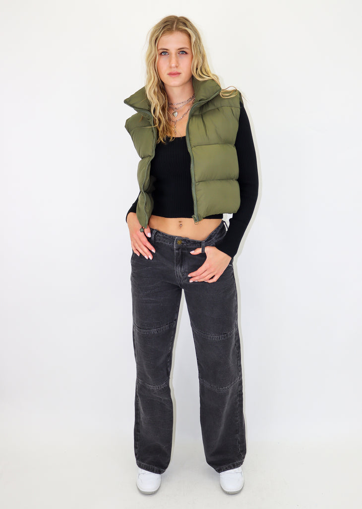Olive green puffer vest. Zip-up front enclosure. Cropped fit.