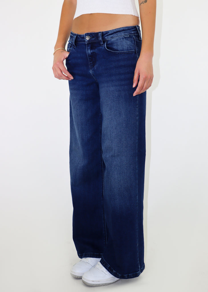 Dark-wash low waisted, loose fit jean.