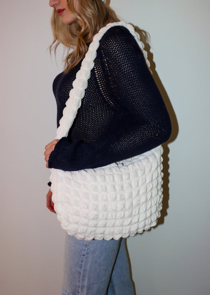 This trendy white bubble ruched quilted fabric tote bag is going to become newest your obsession! An everyday purse, work tote, or gym bag.