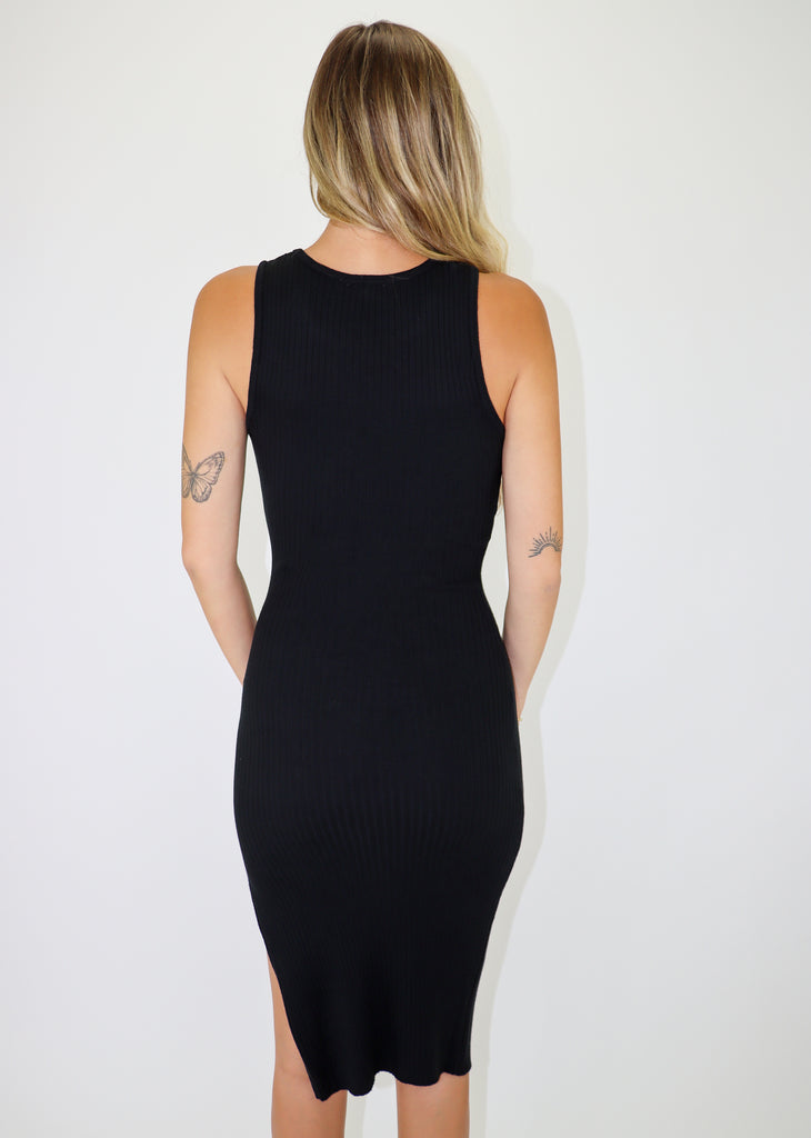 Black midi slip dress featuring a halter neckline, bodycon fit, and ribbed material.