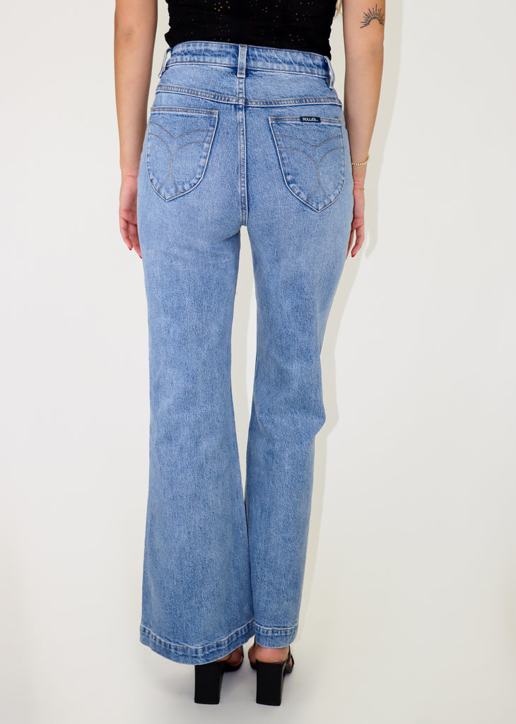 Light wash flare jeans with front patch pockets.