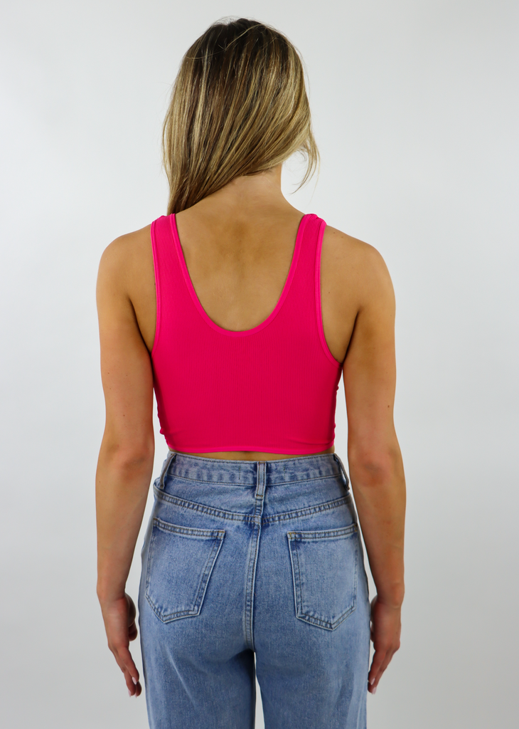 hot pink seamless ribbed low cut scoop neck stretchy twist front reversible crop tank top