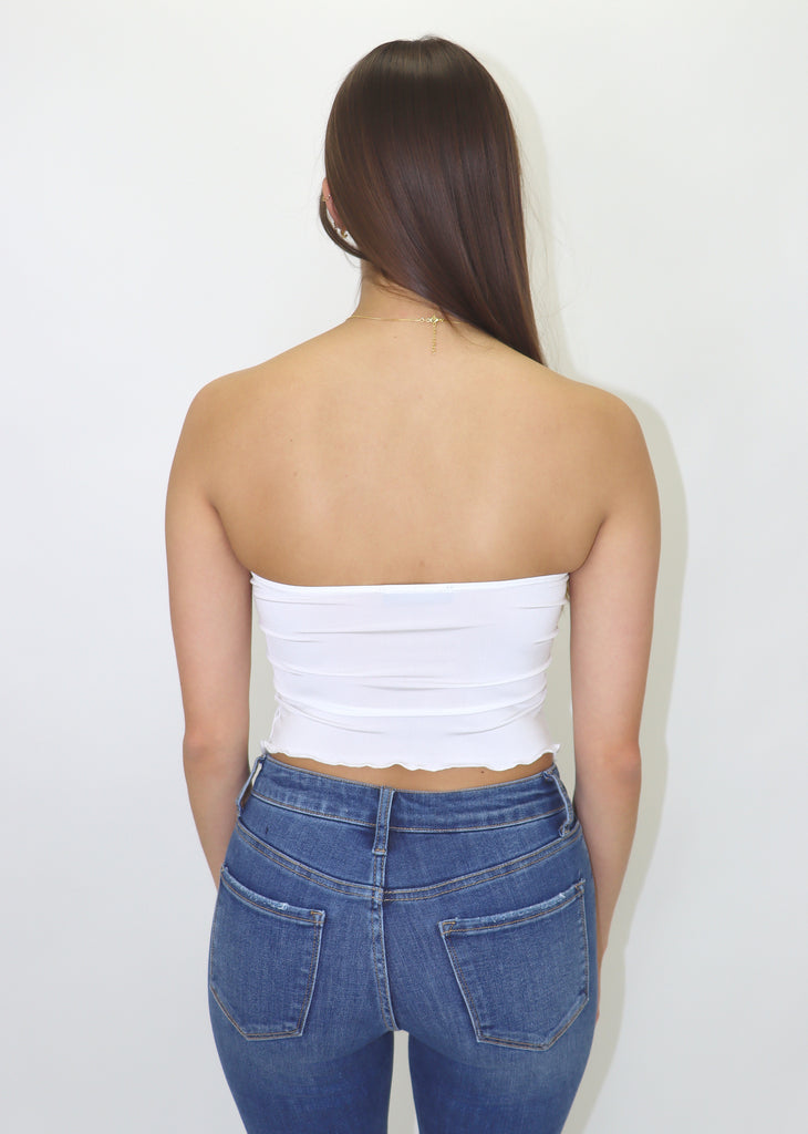 Strapless white top, twist top, front opening.