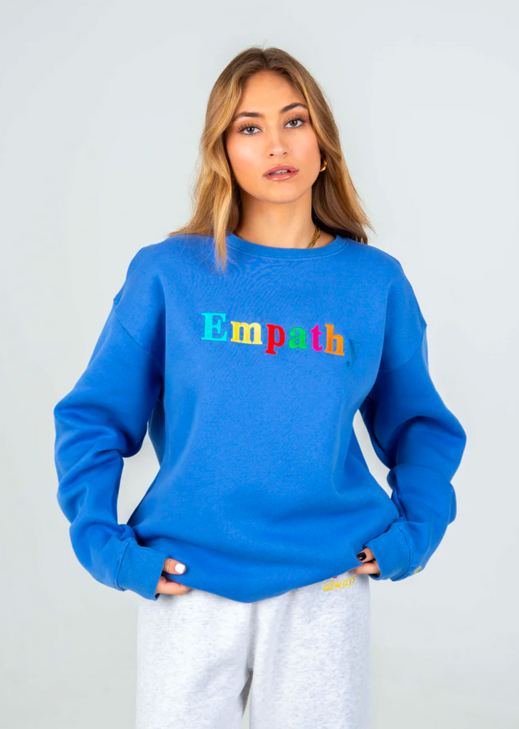 Mayfair Empathy Always crewneck sweatshirt, oversized fit, rainbow empathy letters across chest, cobalt blue