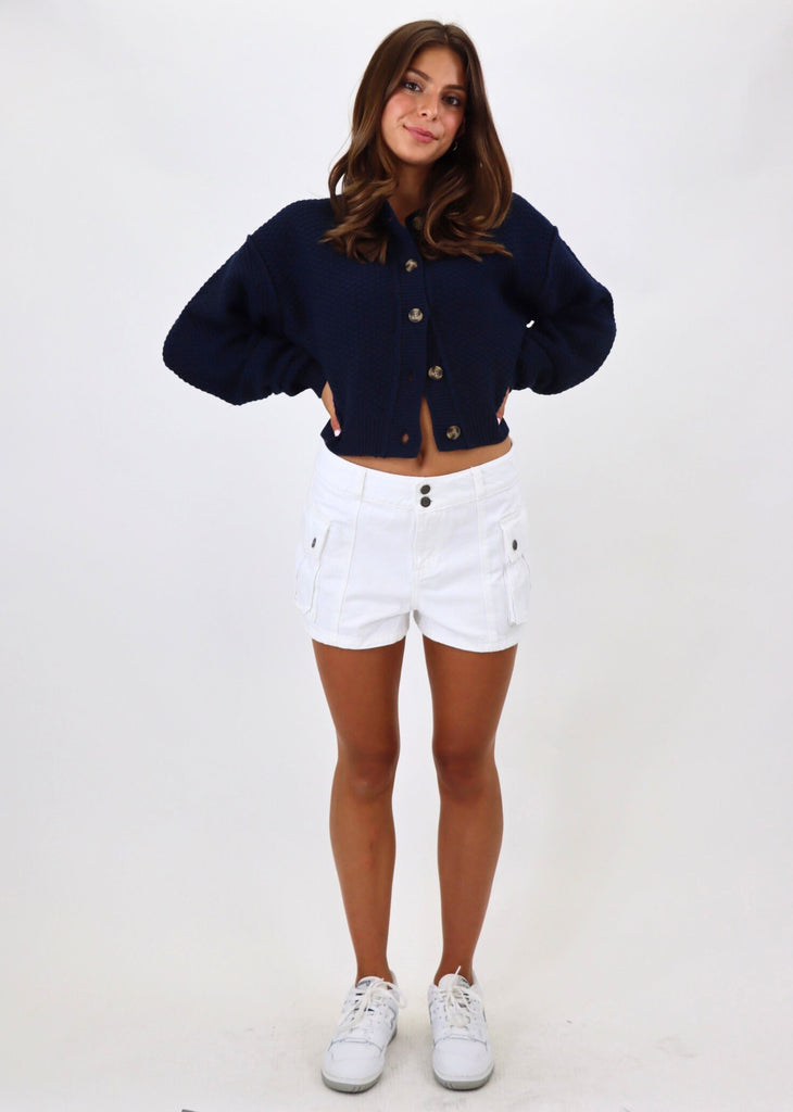 white jean shorts with cargo pockets button detailing low rise 