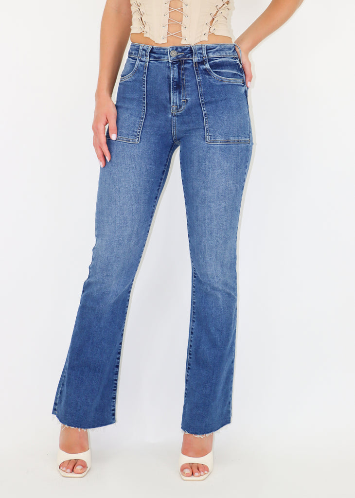 Classic medium wash jeans. Patch front pockets. No rips. Flare bottom.