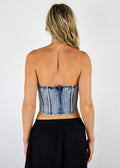Strapless denim corset top, acid wash denim color. Back zipper enclosure.