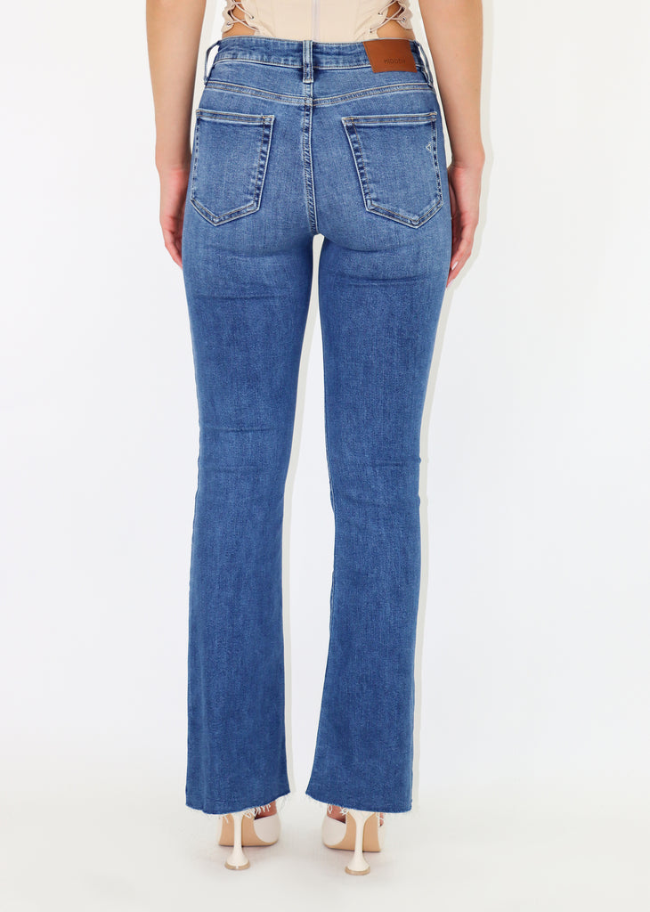 Classic medium wash jeans. Patch front pockets. No rips. Flare bottom.
