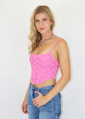 Pink corset top. Fully lined lace overlay. Lace up back adjustable straps. Curved front hem.