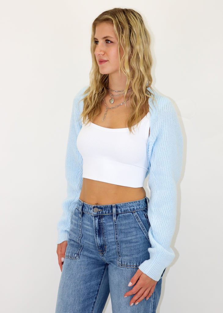 Extreme cropped fit light blue cardigan shrug, knitted ribbed material.