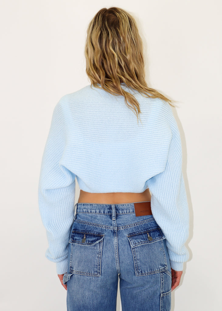 Extreme cropped fit light blue cardigan shrug, knitted ribbed material.