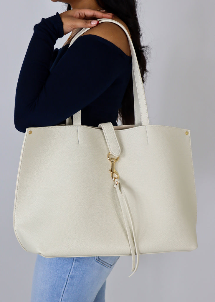 Cream leather tote bag with keychain detail and outside pocket