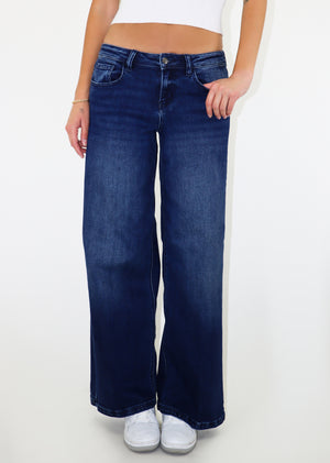 Dark-wash low waisted, loose fit jean.