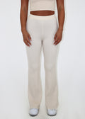 High waisted bell bottom off-white knit pants.