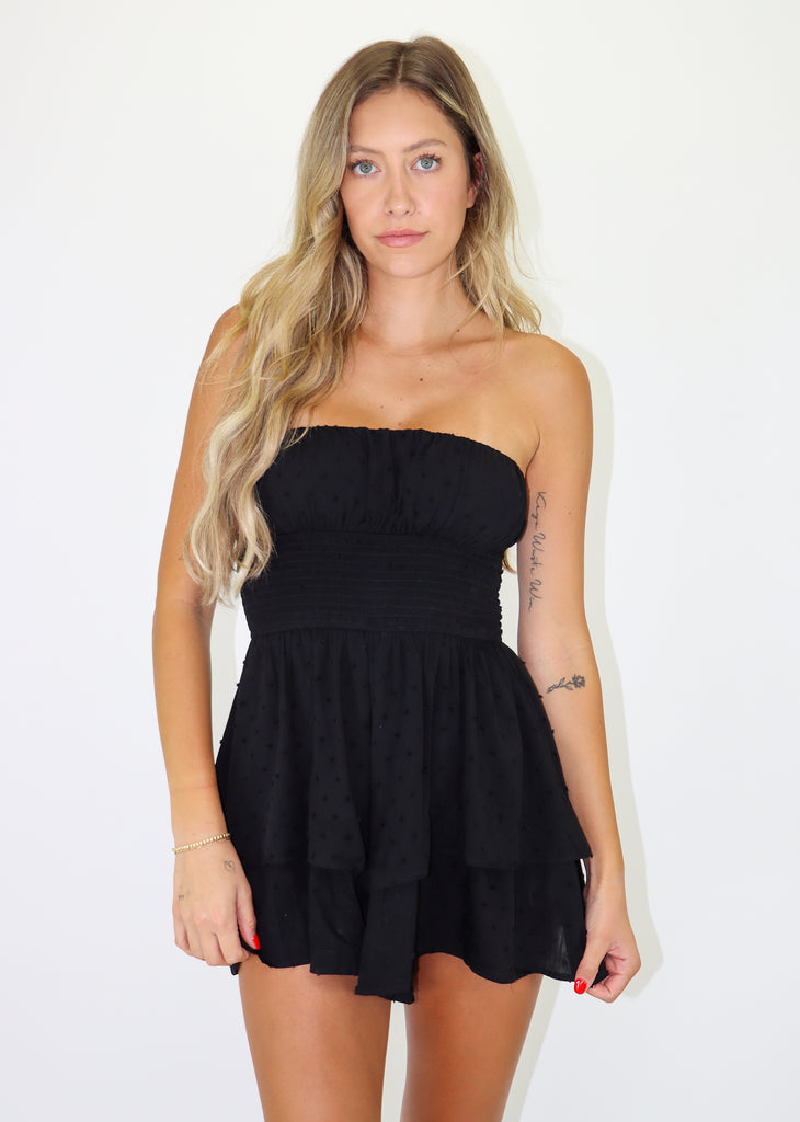 Black strapless romper featuring Dobby Dot Print, Smocked Waist and Tiered Bottom.