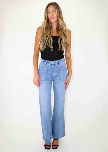 Light wash flare jeans with front patch pockets. 