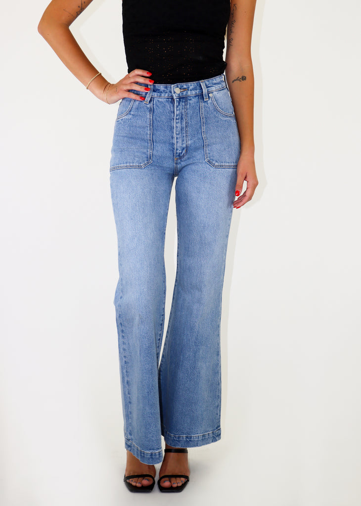 Light wash flare jeans with front patch pockets.