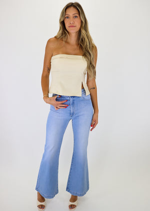 Light wash flare jeans with pockets in front and back.