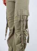 Cargo parachute pants, drawstring waistline, cargo pockets with belt buckle, ruched side detailing.