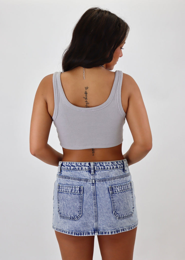 Stay chic and comfortable in our grey ribbed notch slit neck cropped tank top. Perfect for a casual day out or dressing up for a night on the town. Made with high-quality ribbed fabric, this tank top features a trendy slit neck design for added flair. Pair it with your favorite high-waisted jeans or a flowy skirt for a versatile and stylish look.