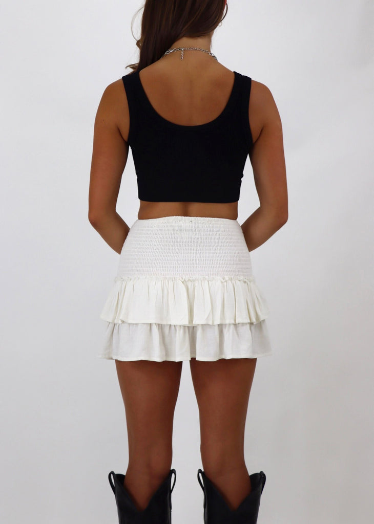 white skirt fitted waist with two ruffle tiers cream color built in shorts 