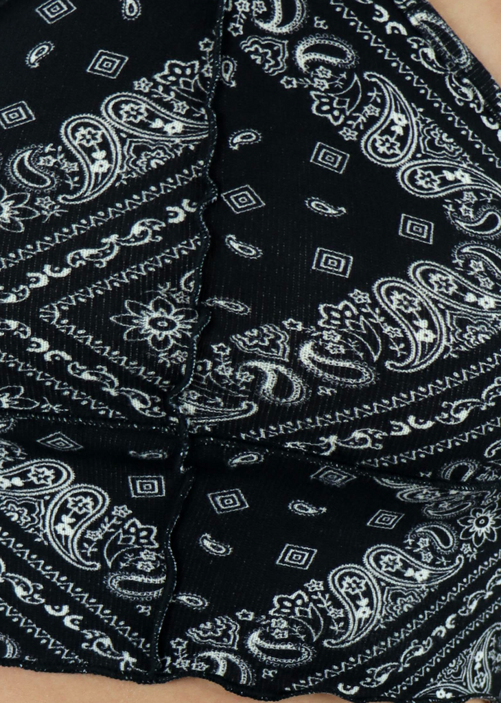 black paisley halter crop top with lettuce trim, exposed seams detailing on front, and an open back