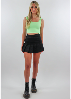 black pleated tennis skort with overlaying shorts