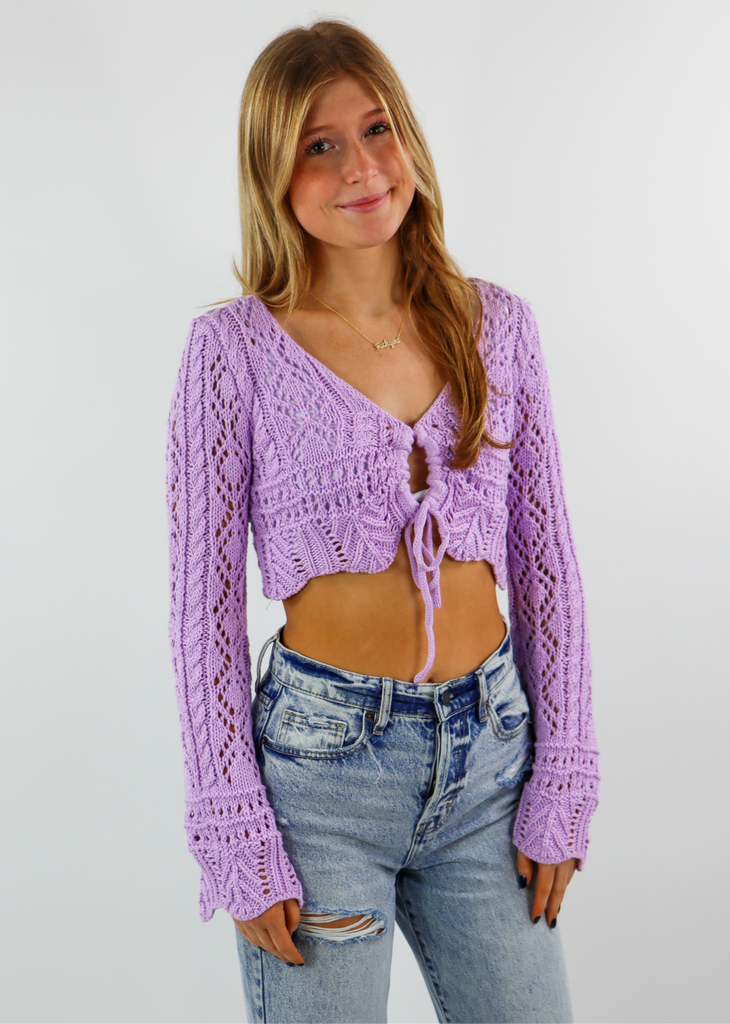Women's lavender crochet cropped cardigan sweater with keyhole tie front and bell sleeves.