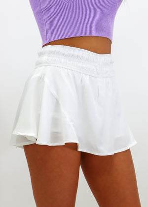white mini skirt with built in shorts cinched waistband flowy trendy