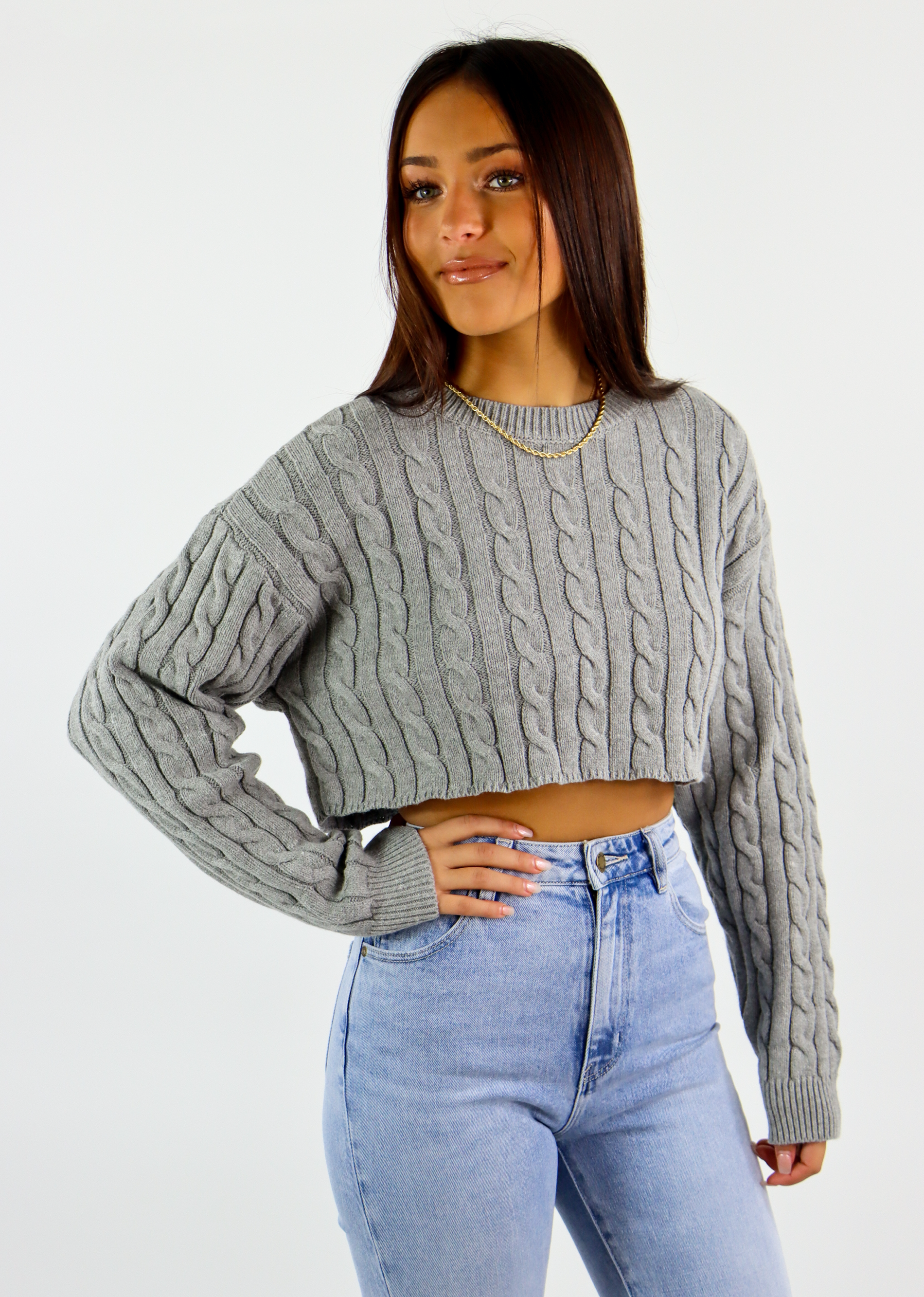 https://shoprocknrags.com/cdn/shop/products/PST230HeatherGreyCableKnitHighNeckCropSweater1.png?v=1666822901