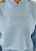Light Blue Baby Blue Comfy Cozy Soft Cropped Hoodie with Embroidered Logo on Right Wrist and the Quote "We all need something to believe in so look in the mirror" Embroidered on the Front Center. 