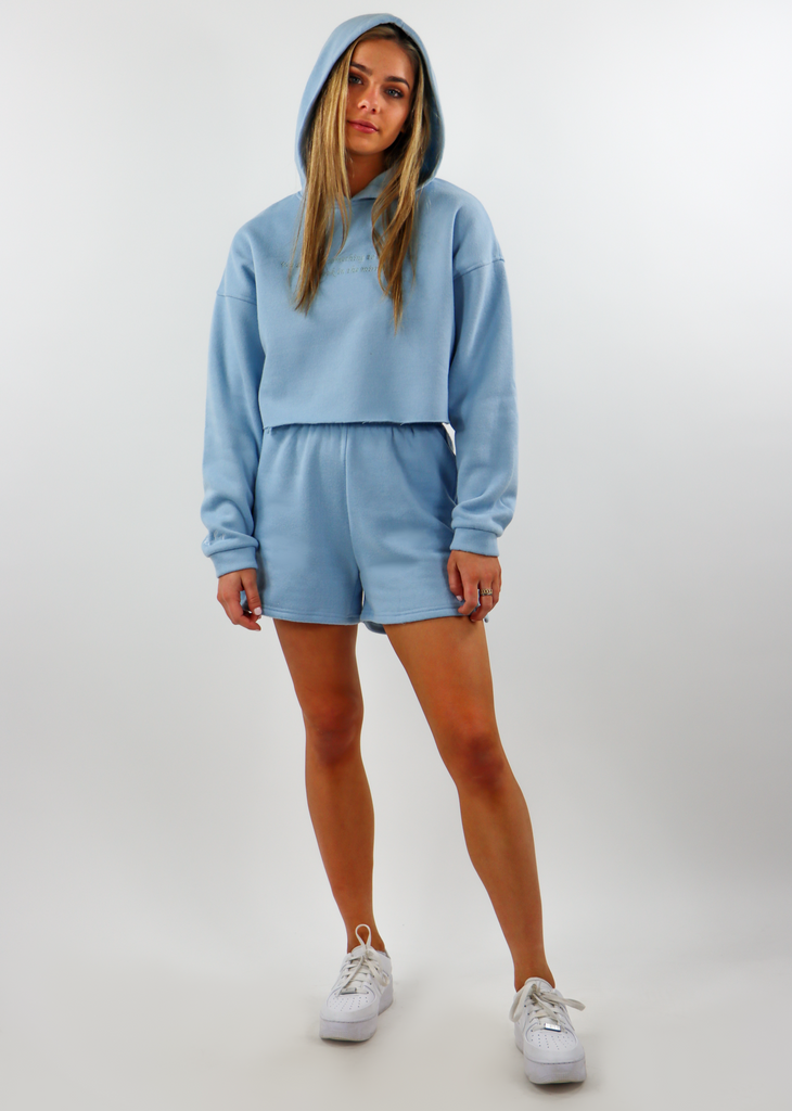 light blue baby blue sweat shorts with two front pockets and an elastic waistline. Another Pocket in Back with Embroidered logo. Can be bought in a matching set with the matching cropped jacket