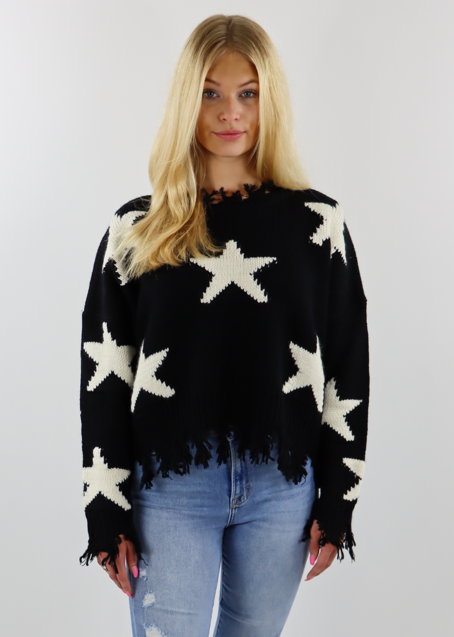 Black jumper sales with white stars