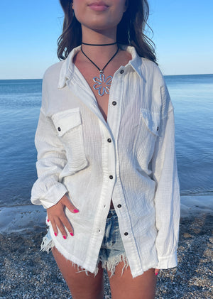 white linen relaxed fit long sleeve button up top raw edge detail two front pockets beach pool cover up casual blouse spring summer winter fall women's clothing